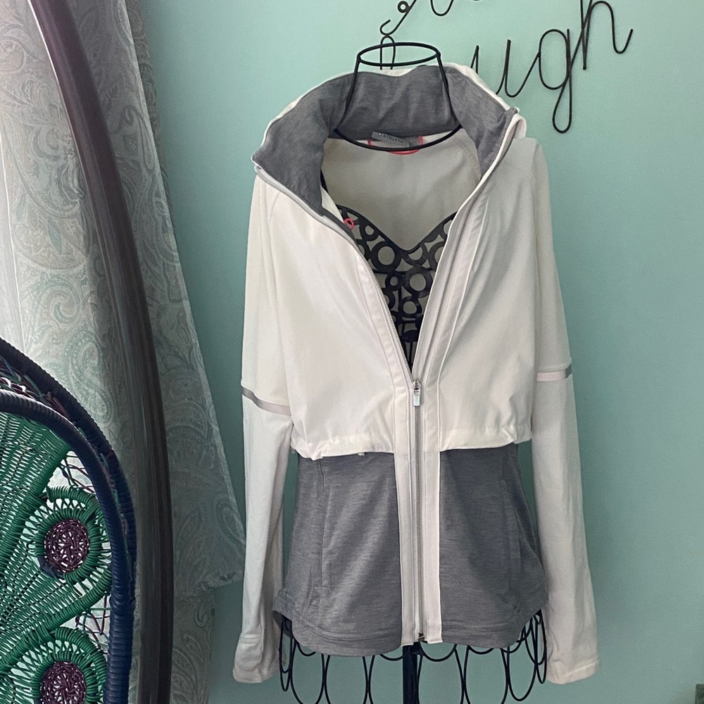 Athleta Women's White and Gray Jacket with reflective strips as pictured.